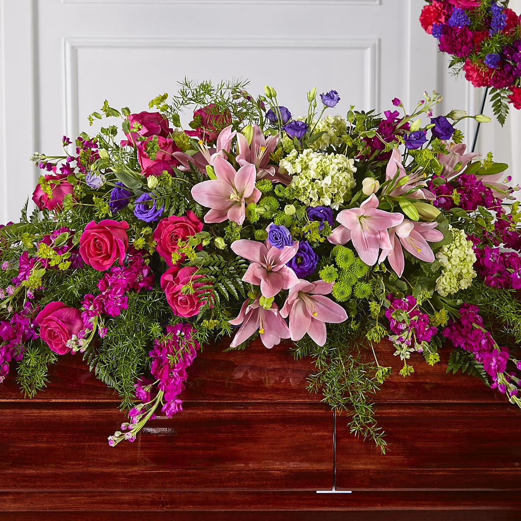Radiant Tribute Casket Spray – PETERSEN & TIETZ FLORISTS & GREENHOUSES, Waterloo IA