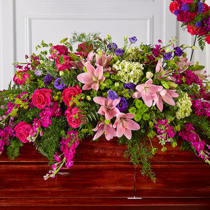 Radiant Tribute Casket Spray – PETERSEN & TIETZ FLORISTS & GREENHOUSES, Waterloo IA